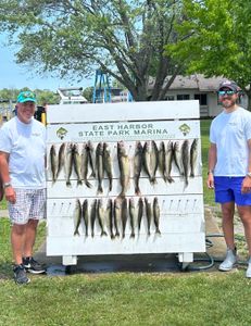 Two anglers fishing at lakeside marblehead