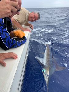 Angler with a 22-inch fish in HI