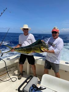Anglers holding a large fish in Hawaii