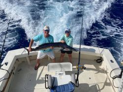 A photo of two people fishing in Kailua-Kona