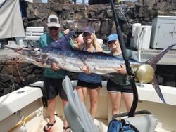 A group of 3 people fishing in Kailua-Kona