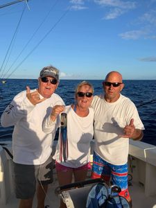 Three people enjoying fishing in Kailua-Kona
