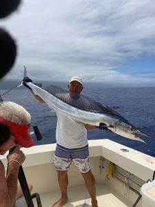 A lone fisherman in Hawaii catches a 48-inch fish