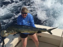A person fishing with a big 38-inch catch in Hawaii