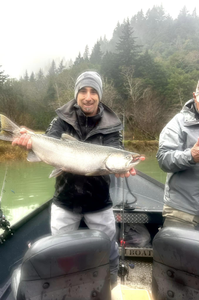 Angler holding a 27-inch fish in Port Orford