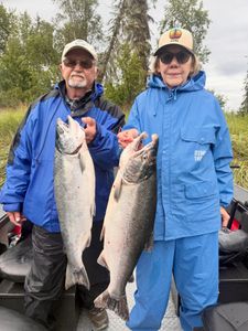 Two anglers fishing for rainbow trout and coho salmon in Port Orford