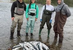 Three people fishing in Port Orford