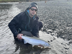 Fisherman catches a rainbow trout in OR