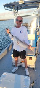 Angler with fishing rod in Rockport