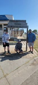 Three anglers enjoying a fishing trip in TX