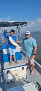 Two people fishing in TX