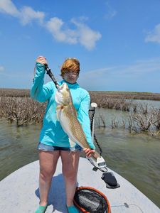 A single fisherman casting a line in Texas