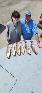 Four fish caught by two people at Rockport