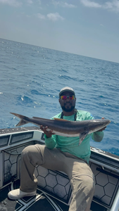 Angler with their catch on the shore in FL