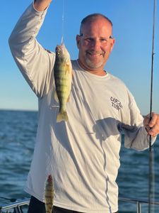 Two anglers fishing in the waters of Port Clinton