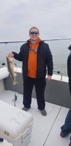 Angler holding a 14-inch fish in Port Clinton