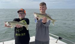 2 happy anglers holding their catch in OH