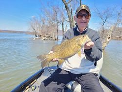 All Smiles Showing his Trophy Smallmouth bass!