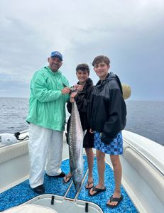 3 anglers with a big fish caught at Vero Beach
