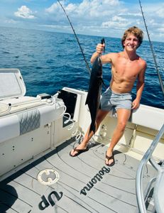Angler holding a large fish in Vero Beach