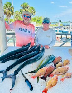 Three people fishing on the beach in Vero Beach