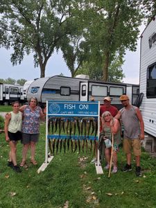Five people fishing at the lakeside in Marblehead