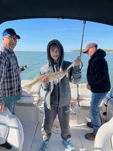 A group of 3 people fishing at the Lakeside Marblehead location