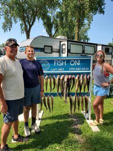 Three people enjoying a day of fishing at Lakeside Marblehead
