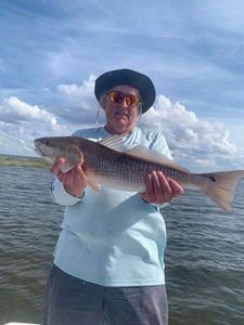 Proud angler with a magnificent redfish catch in FL