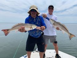 Two big redfish caught during fishing trip in Spring Hill