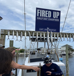 5 great barracuda, cero mackerel, spanish mackerel, and king mackerel fish caught at Carolina Beach