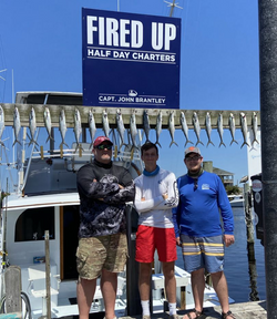 Three people enjoying a great fishing trip in Carolina Beach