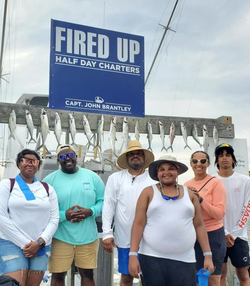 Six people enjoying a fishing trip at Carolina Beach