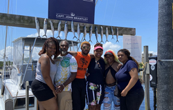 Group of 6 people enjoying a fishing trip at Carolina Beach