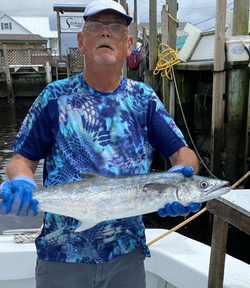 A person fishing for a king mackerel in North Carolina