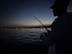 Cloudy skies set the stage for an epic fishing adventure at Wells Harbor!