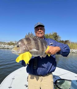 A person fishing for a sheepshead in New Orleans