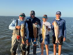 4 fishermen catching big fish in Brownsville