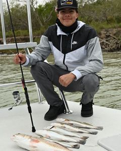 A person fishing with a rod in Texas