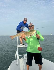 Two people fishing in Brownsville