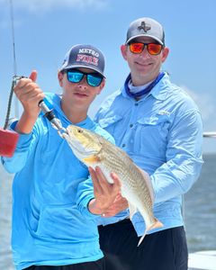Two people fishing in Brownsville