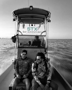Two people fishing in Brownsville
