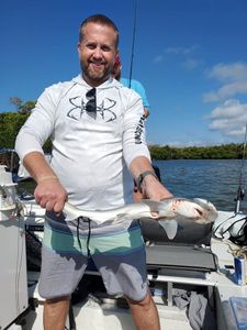 Man fishing with rod in Naples location