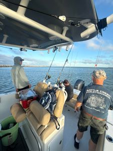 Fishing boat with multiple fishing rods set up on calm waters near Port Orange FL