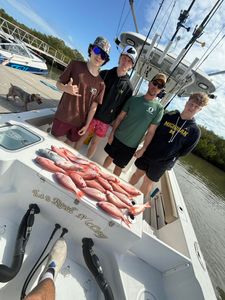 Fresh caught red snapper displayed on fishing boat deck in Port Orange FL