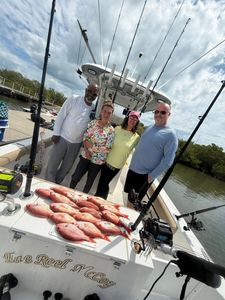 Successful fishing charter in Port Orange FL showing fresh catch of red snapper on boat deck