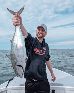 Angler with a little tunny fish in Florida