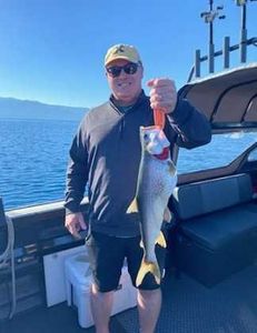 Angler with big fish at Tahoe Vista