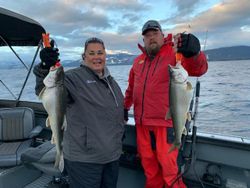 Two anglers with big fish at Tahoe Vista