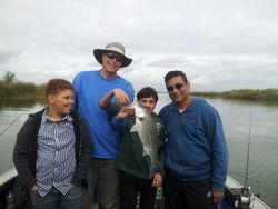 Four people fishing in the scenic Tahoe Vista location